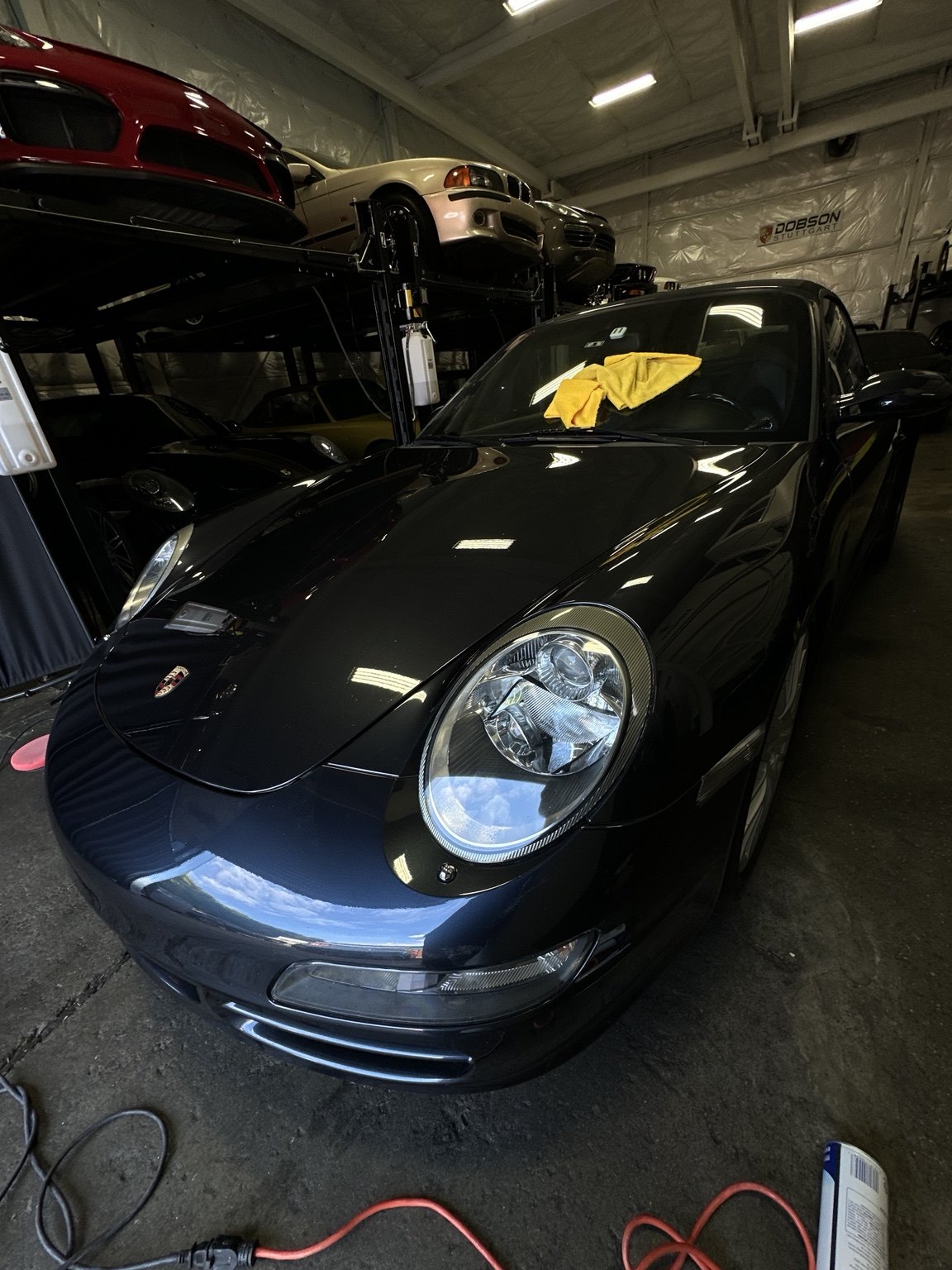 Black Porsche during detailing